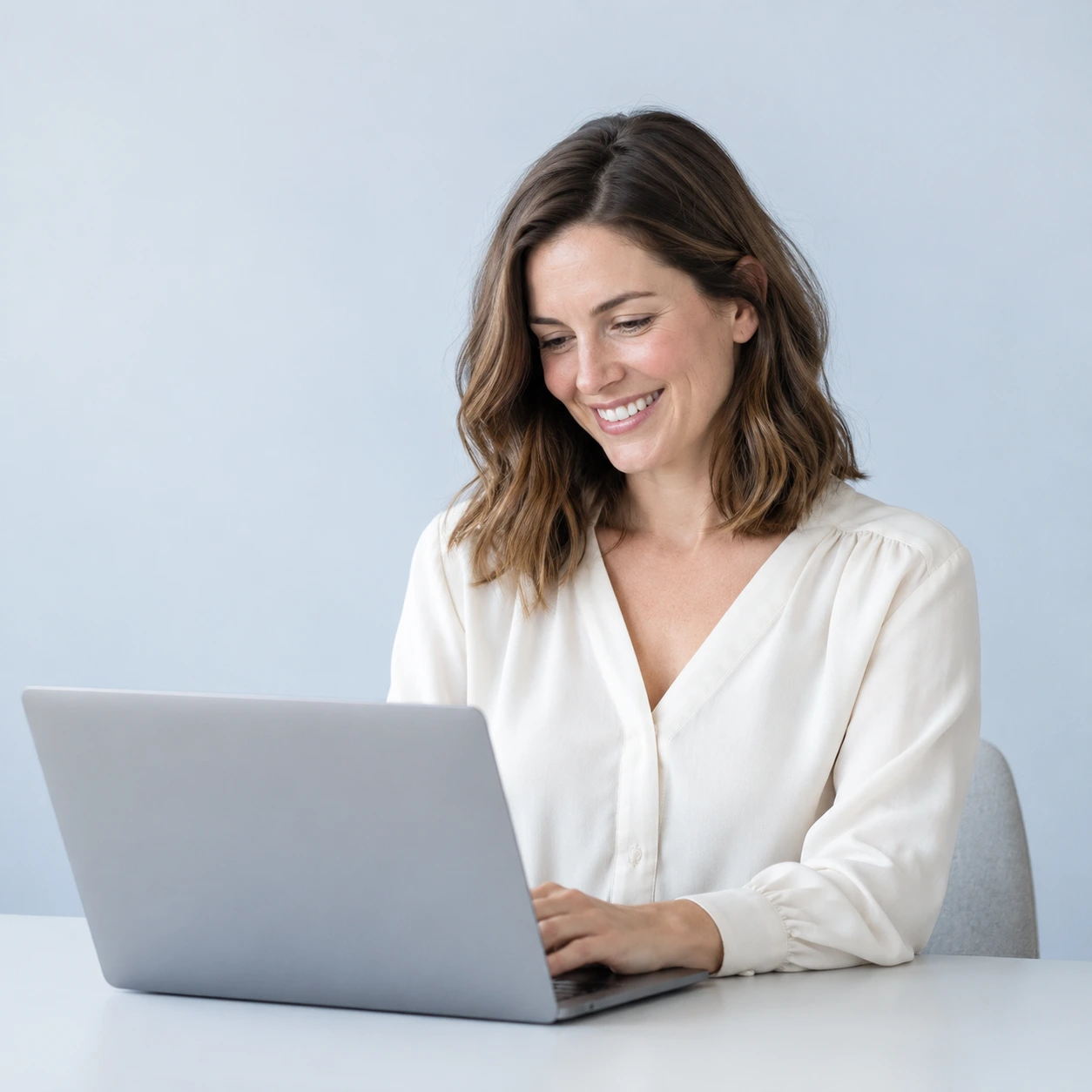 A woman working at her laptop